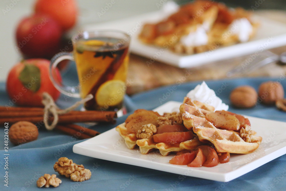 waffles sered with walnuts, honey and baked aples