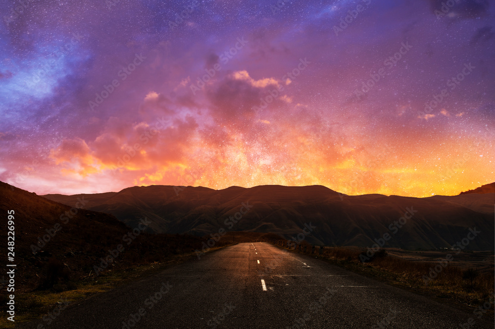 Beautiful road and sunset sky with clouds.