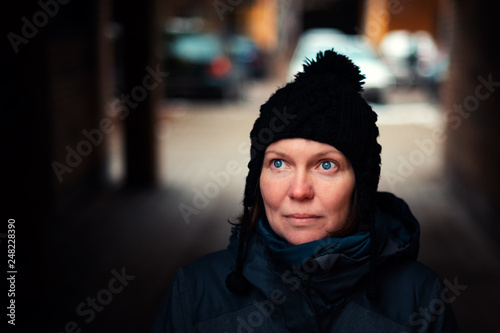 Beautiful hopeful adult caucasian woman portrait on the street © Bits and Splits
