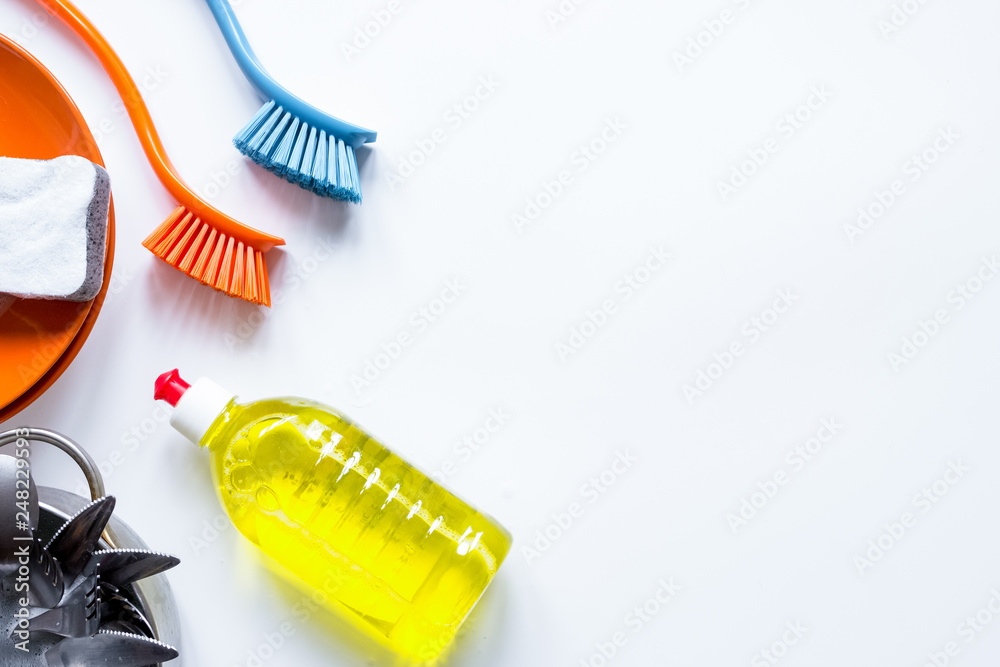 concept of washing dishes on white background top view