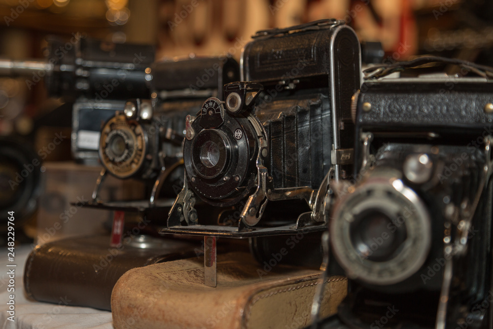 Ancient Folding Cameras with Bellows on their Leather Cases Ancient Folding Cameras with Bellows on their Leather Cases