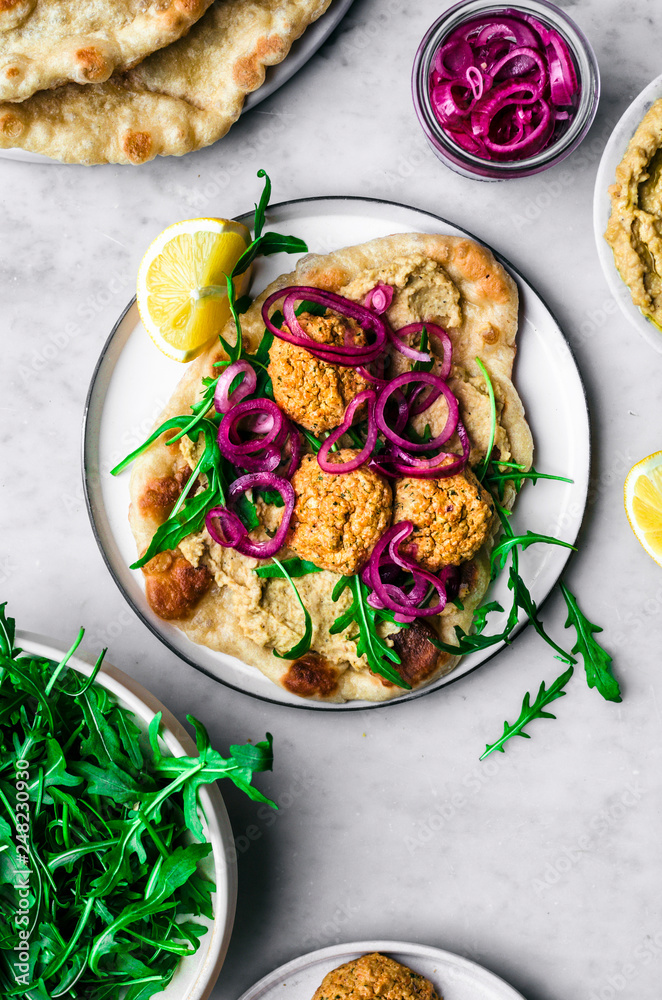 Red Lentil Falafel with Hummus, Naan, Greens, and Pickled Onions Red Lentil Falafel with Hummus, Naan, Greens, and Pickled Onions