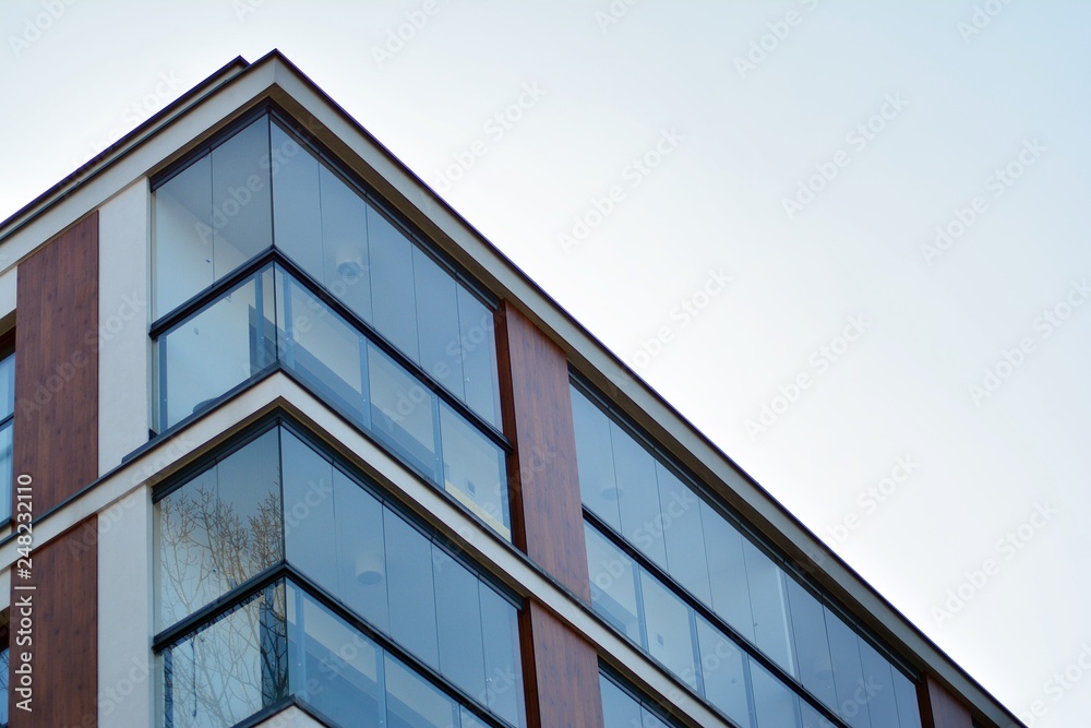 Modern apartment buildings on a sunny day with a blue sky. Facade of a modern apartment building