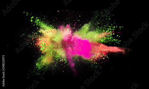 Multi colored powder explosion isolated on black