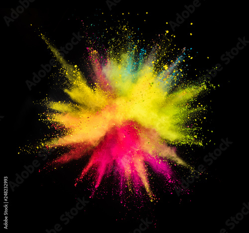 Multi colored powder explosion isolated on black © Jag_cz