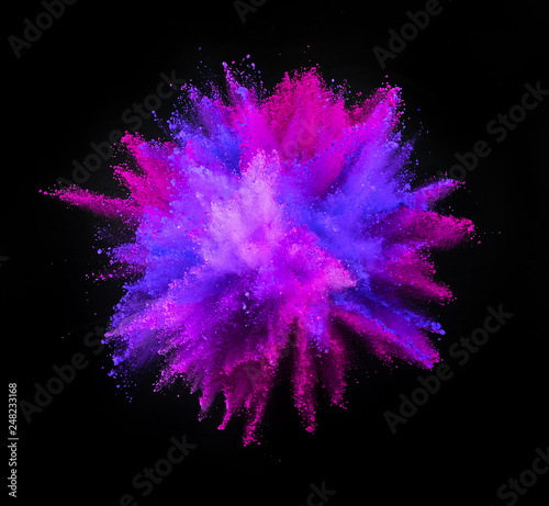 Multi colored powder explosion isolated on black