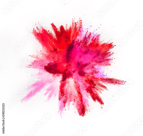Multi colored powder explosion isolated on white