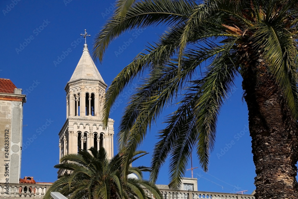 Historical architecture on Riva Promenade in Split, Croatia with landmark Saint Domnius bell tower.