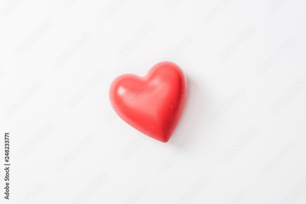 Top view of toy heart on grey background