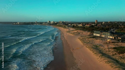 Flying over an empty beach on the northern coast of Sydney