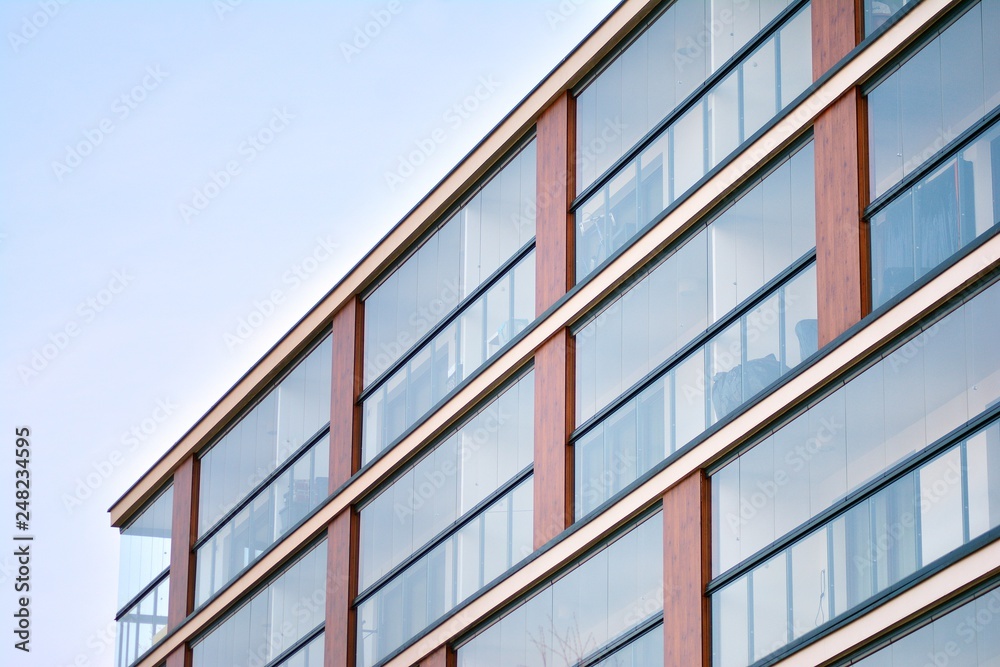 Modern apartment buildings on a sunny day with a blue sky. Facade of a modern apartment building Modern apartment buildings on a sunny day with a blue sky. Facade of a modern apartment building