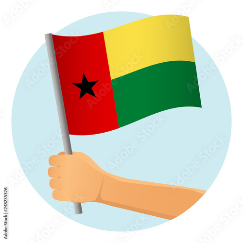 Guinea-Bissau flag in hand