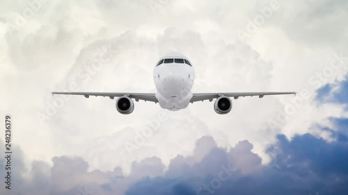 Airplane Flying Overhead against Cloudy Stormy Blue Sky