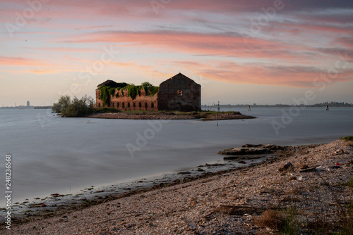 ruin of an old house in a small island in the Venice lagoon at sunset. photo