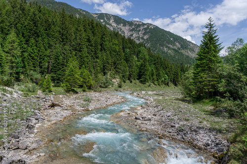Wonderful small river flowing in the Alps