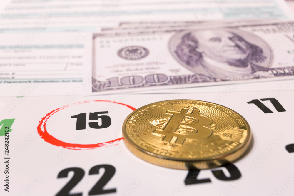 Bitcoin and 2019 calendar with 1040 income tax form for 2018 showing tax day for filing on April 15 Bitcoin and 2019 calendar with 1040 income tax form for 2018 showing tax day for filing on April 15