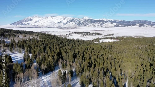 Dramatic aerial flying over majestic winter landscape in Montana photo
