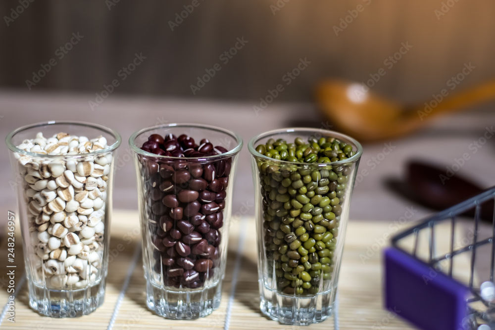 Cereals in glass cups placed on a wooden background Cereals in glass cups placed on a wooden background