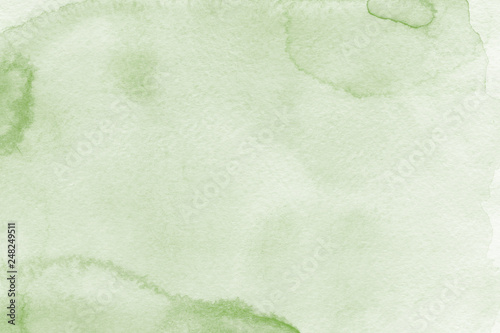 Watercolor green texture with abstract washes and brush strokes on the white paper background. Digital paper background.