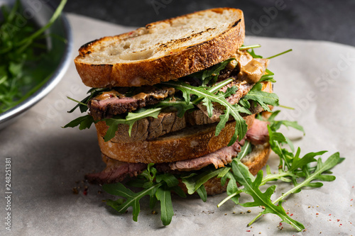 Roast beef sandwich with rugula and mustard photo