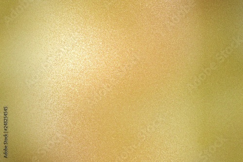 Texture of yellow brushed metallic plate, abstract background
