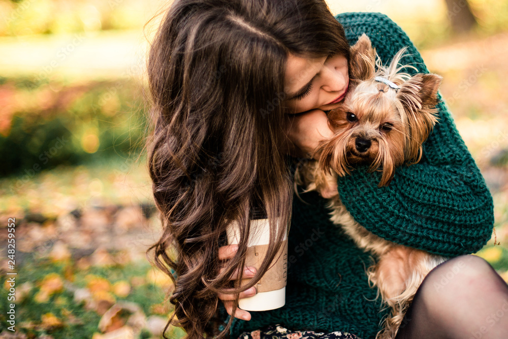 Beautiful woman walk with dog and drink coffee in the park. Beautiful woman walk with dog and drink coffee in the park.