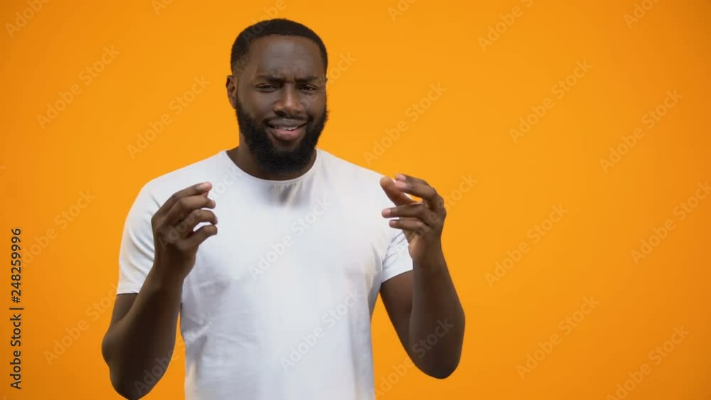 Confident man showing his ideal outfit, trying to impress woman, acquaintance Confident man showing his ideal outfit, trying to impress woman, acquaintance