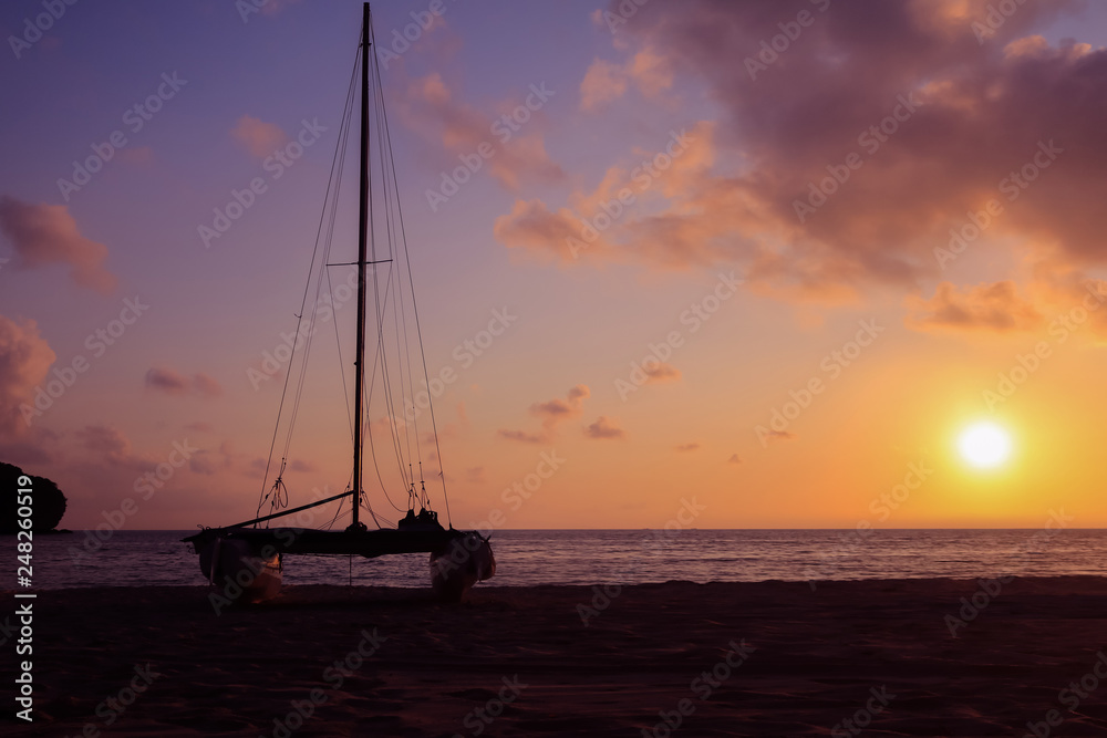 Hobie cat or catamaran on the beach at beautiful sunrise early morning