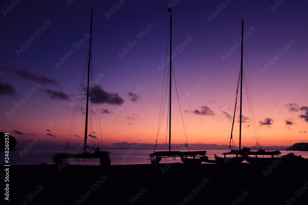 Hobie cat or catamaran on the beach at beautiful sunrise early morning