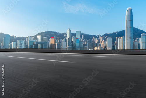 Road and skyline of modern urban architecture in Hong Kong..