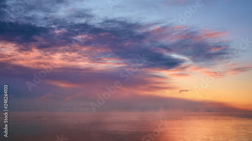 Beautiful dreamy sunrise clouds over horizon © Like
