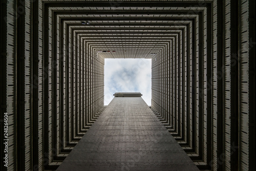 Looking up through a building to the sky