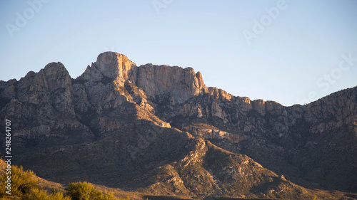 sunset with mountains in the background. arizona desert © Mike