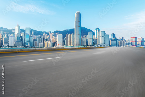 Road and skyline of modern urban architecture in Hong Kong..