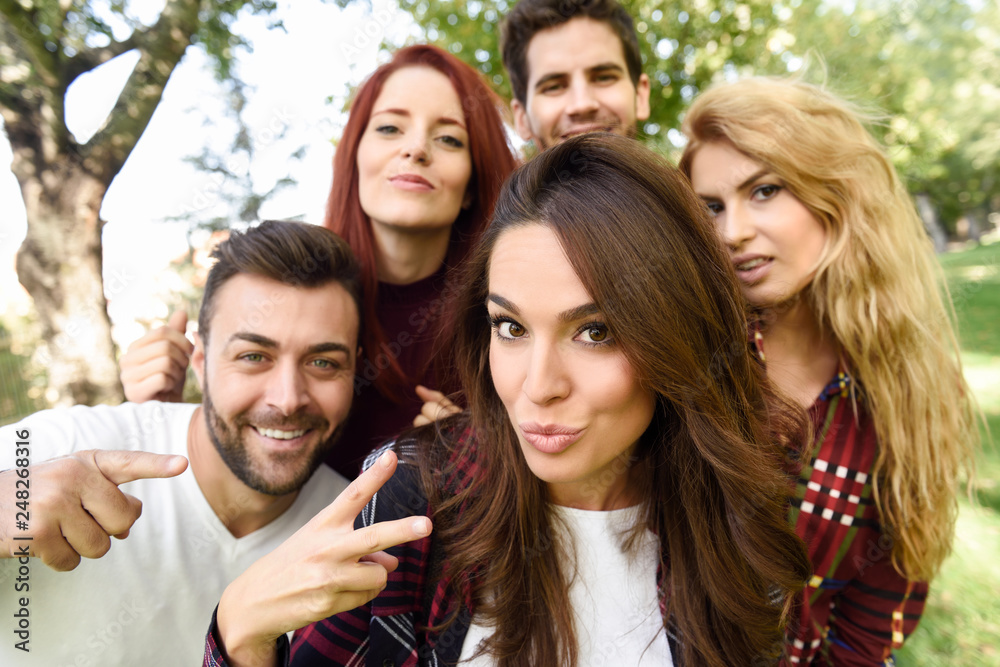 Group of friends taking selfie in urban background Group of friends taking selfie in urban background