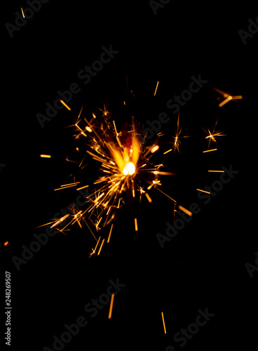 Sparks of fire on a black background welding fireworks.