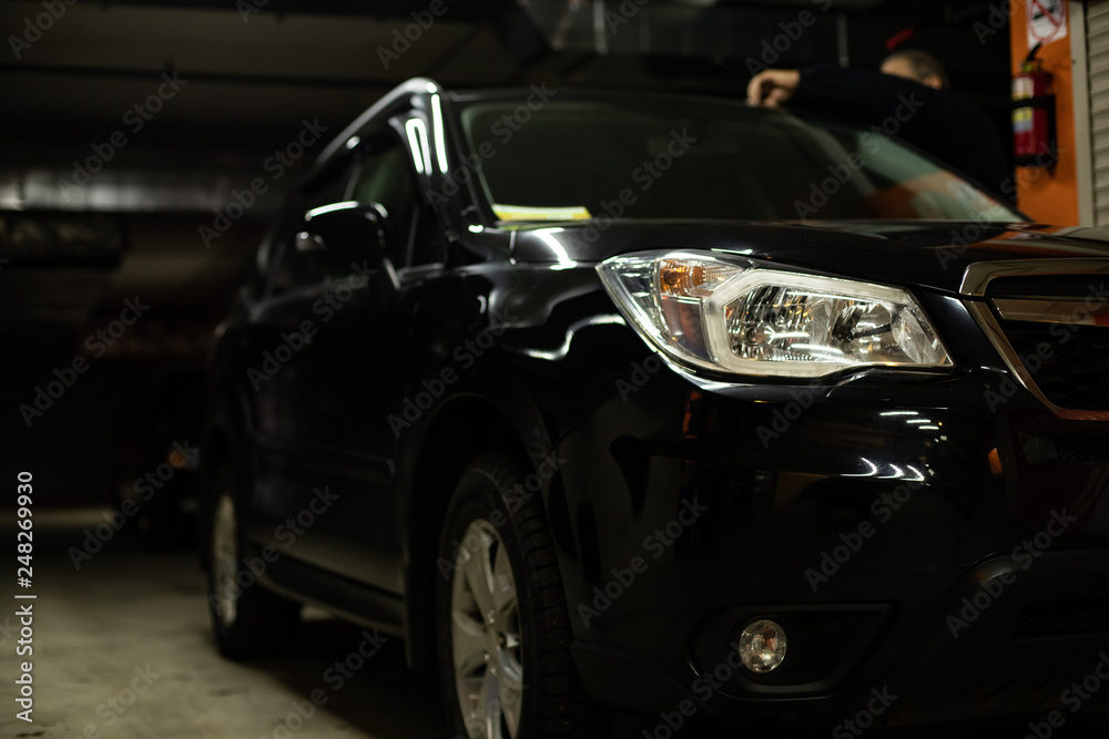 Man driver inspects the car Man driver inspects the car