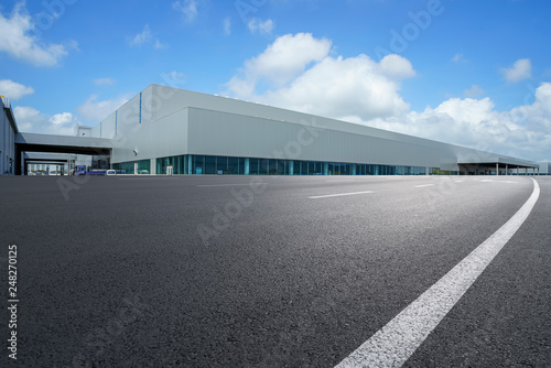 Road asphalt pavement and modern factory warehouse.. © 昊 周