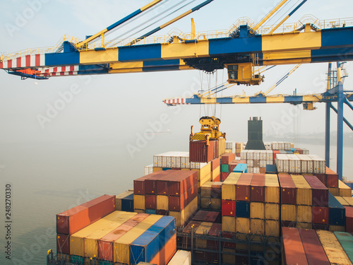 Containers vessels in Nhava Sheva port during cargo operation.