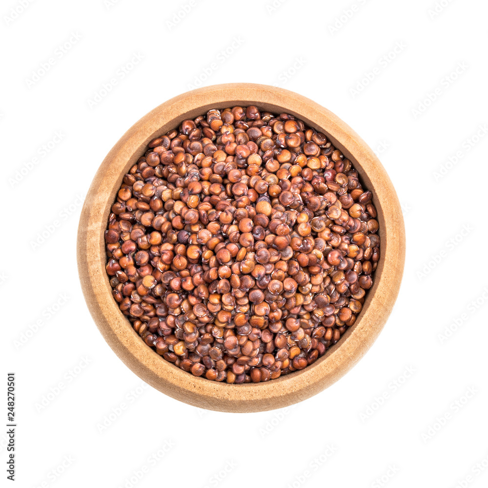 Small wooden bowl with red quinoa seeds seen directly from above and isolated on white background Small wooden bowl with red quinoa seeds seen directly from above and isolated on white background