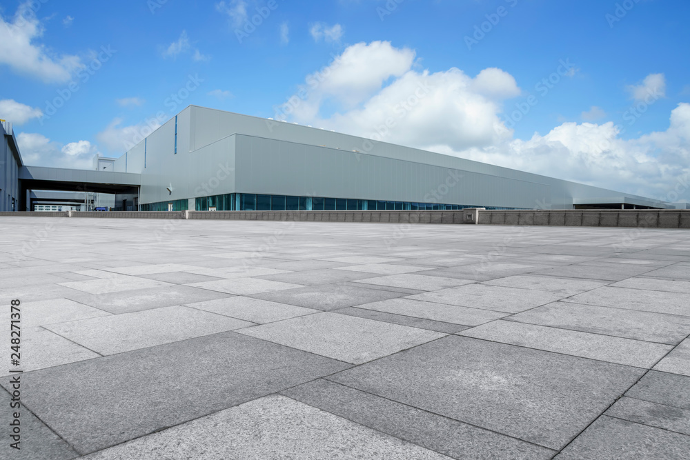 custom made wallpaper toronto digitalEmpty square floor tiles and modern factory buildings and warehouses..