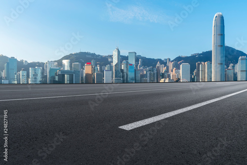 Road and skyline of modern urban architecture in Hong Kong..