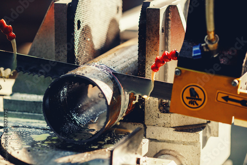 Circular band saw for cutting metal with water cooling