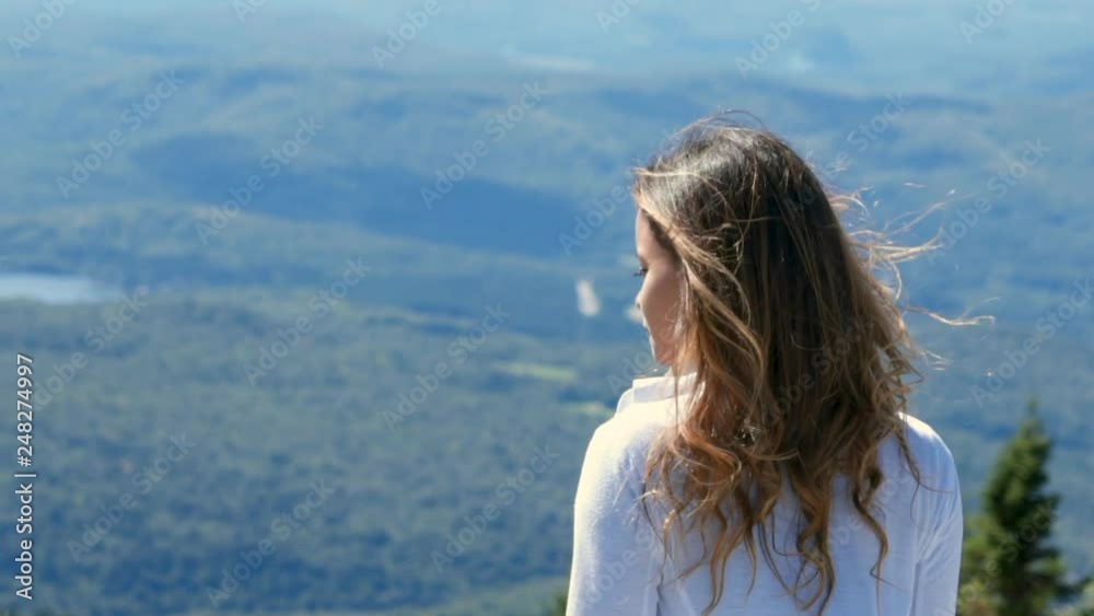 Slow Motion: Young Woman with Long Hair Turning to Show Profile Then Facing Away Slow Motion: Young Woman with Long Hair Turning to Show Profile Then Facing Away