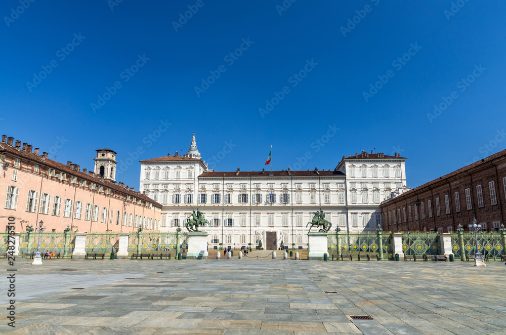 Royal Palace Palazzo Reale building on Castle Square Piazza Castello with fountains and monuments in historical centre of Turin Torino city with clear blue sky, Piedmont, Italy