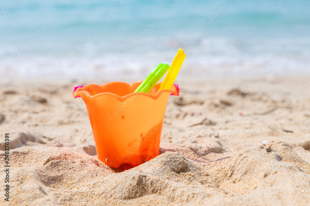Children's beach toys - buckets, spade and shovel on sand on a sunny day. Children's beach toys - buckets, spade and shovel on sand on a sunny day.