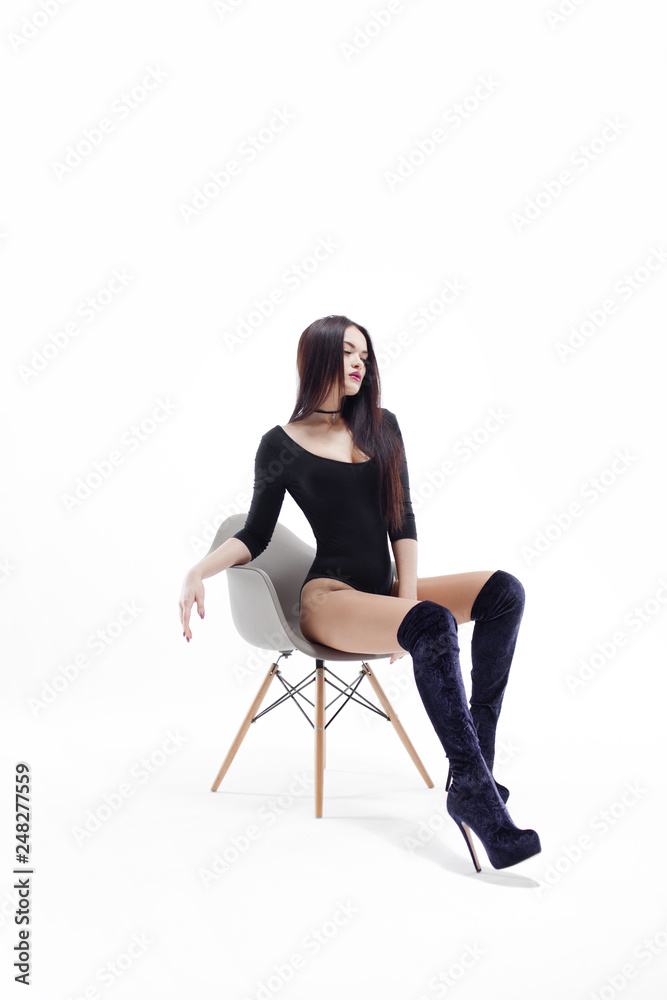 Stylish and elegant brunette in black on white background, portrait in Studio Stylish and elegant brunette in black on white background, portrait in Studio