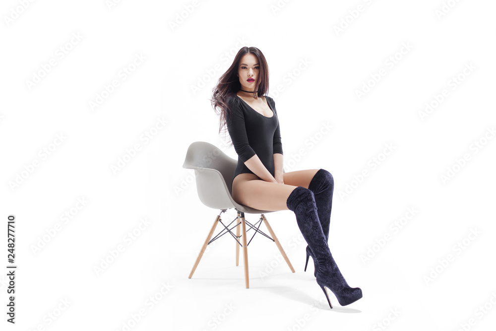 Stylish and elegant brunette in black on white background, portrait in Studio Stylish and elegant brunette in black on white background, portrait in Studio
