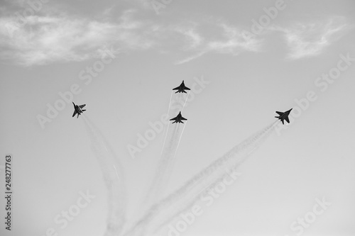 jet fighters make  dissolution aerobatic figure photo
