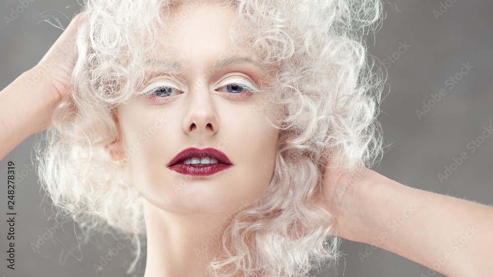 Young attractive woman with platinum blonde and purple lipstick Young attractive woman with platinum blonde and purple lipstick